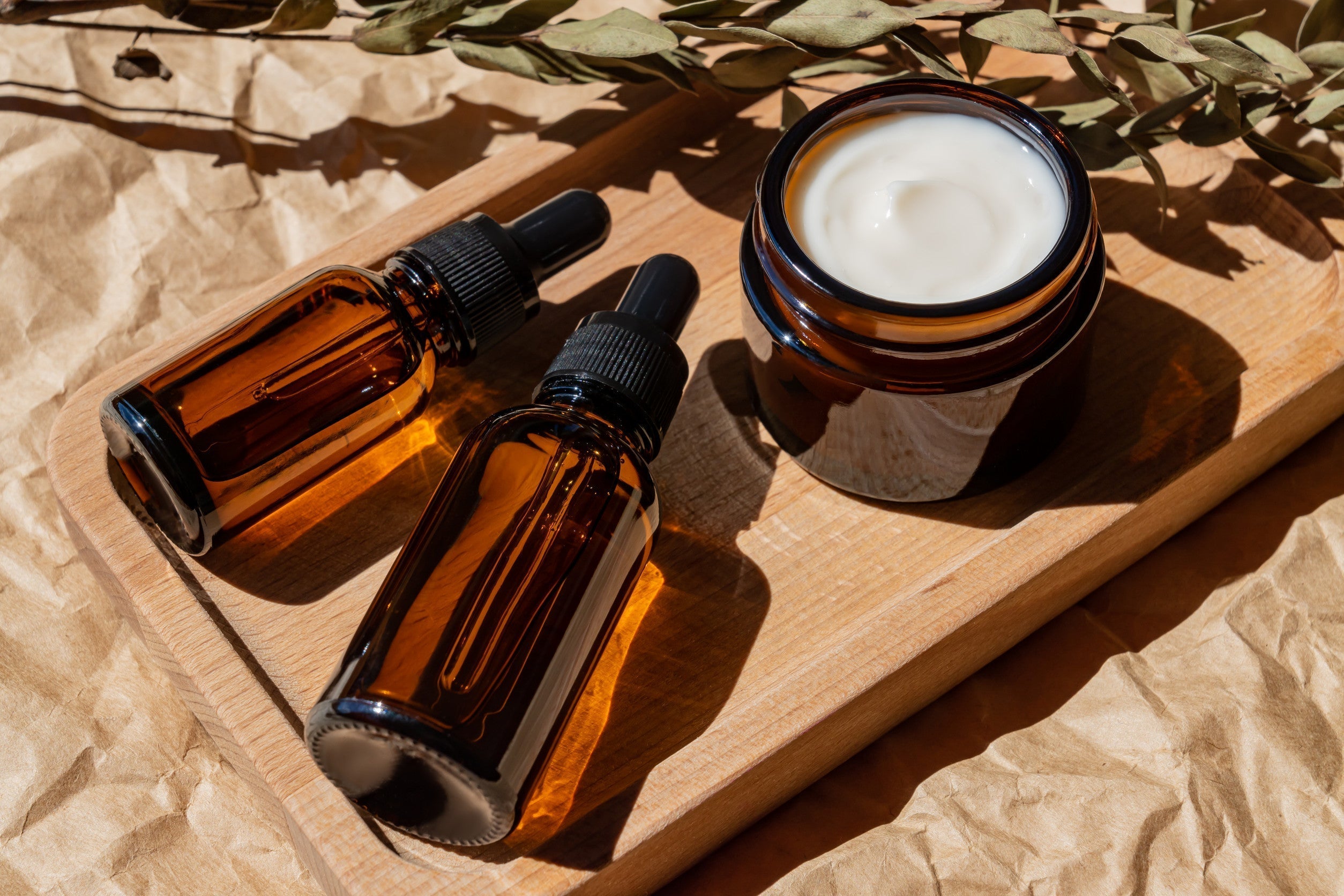 Carrier Oils and Body Butter on wooden tray