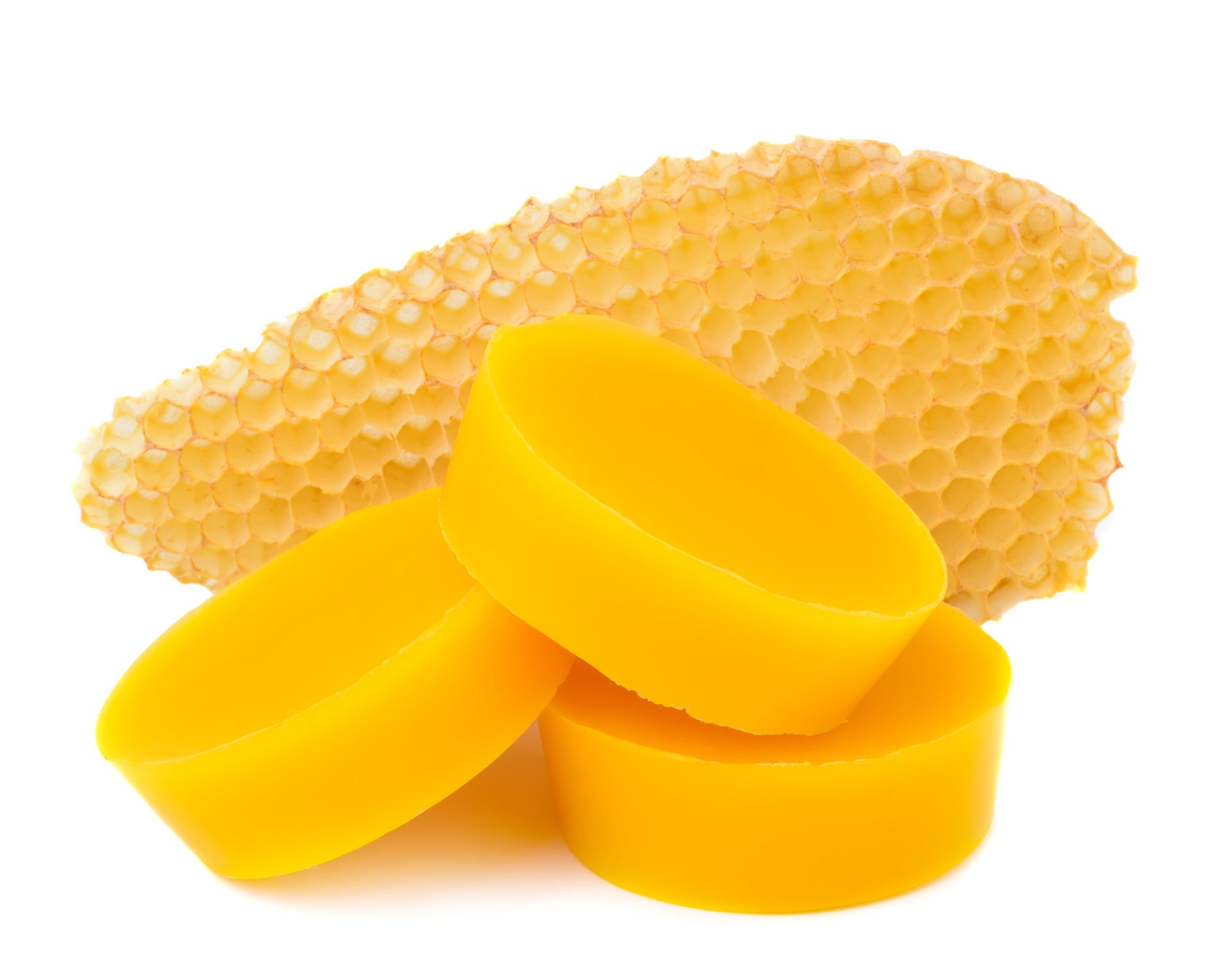 Pieces of natural beeswax and a piece of honey cell
