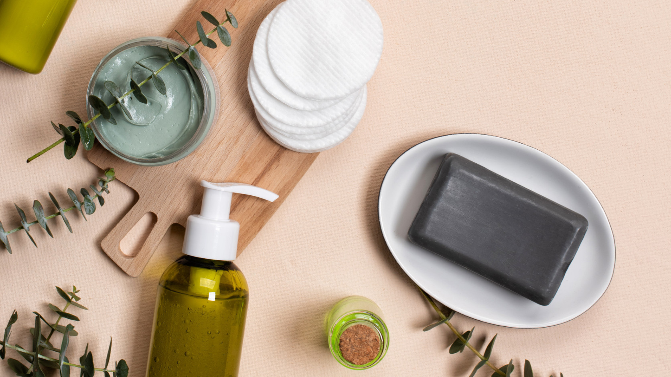 Bottles of essence or serum with natural eucalyptus leaves