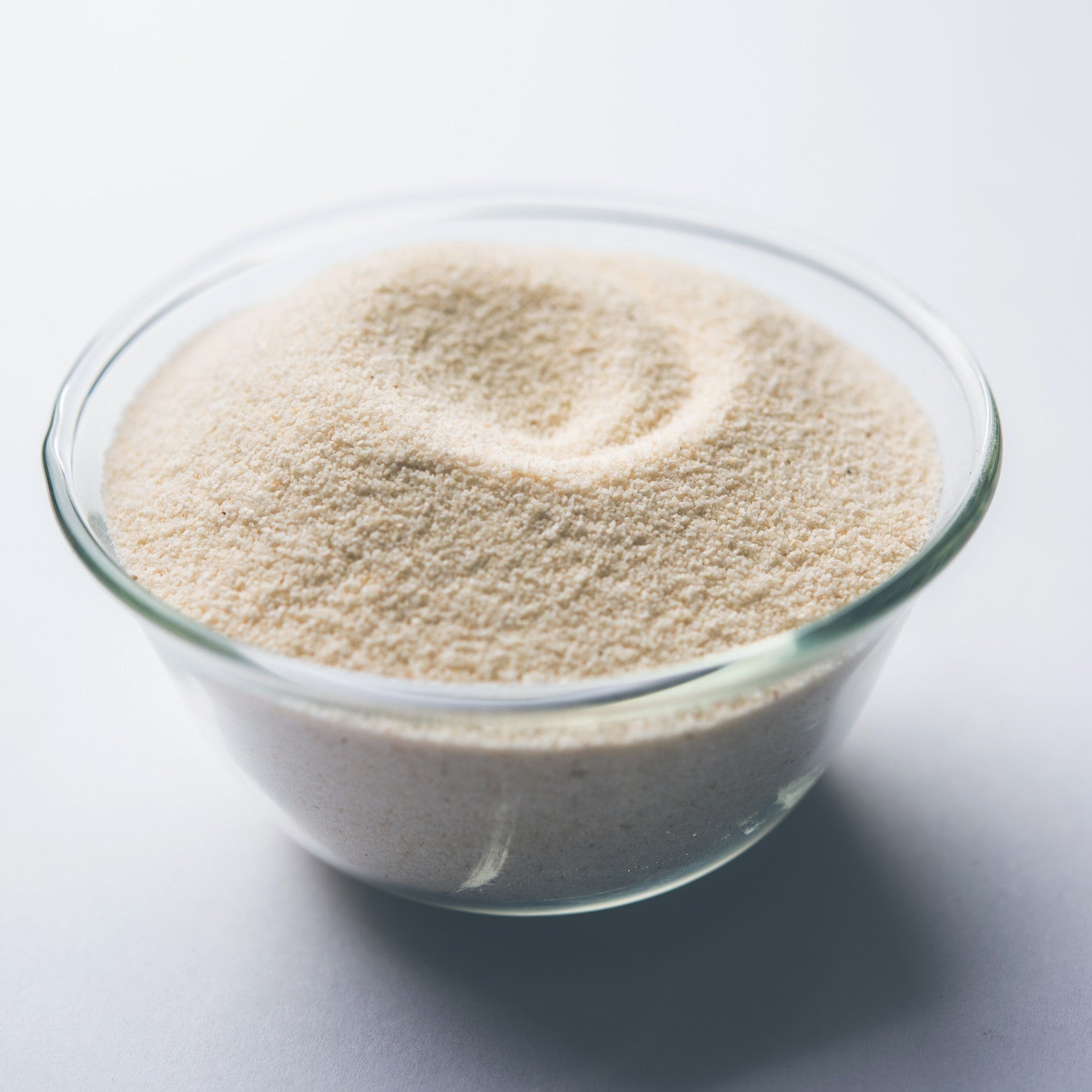 Yeast Beta Glucan in a clear bowl on a white background