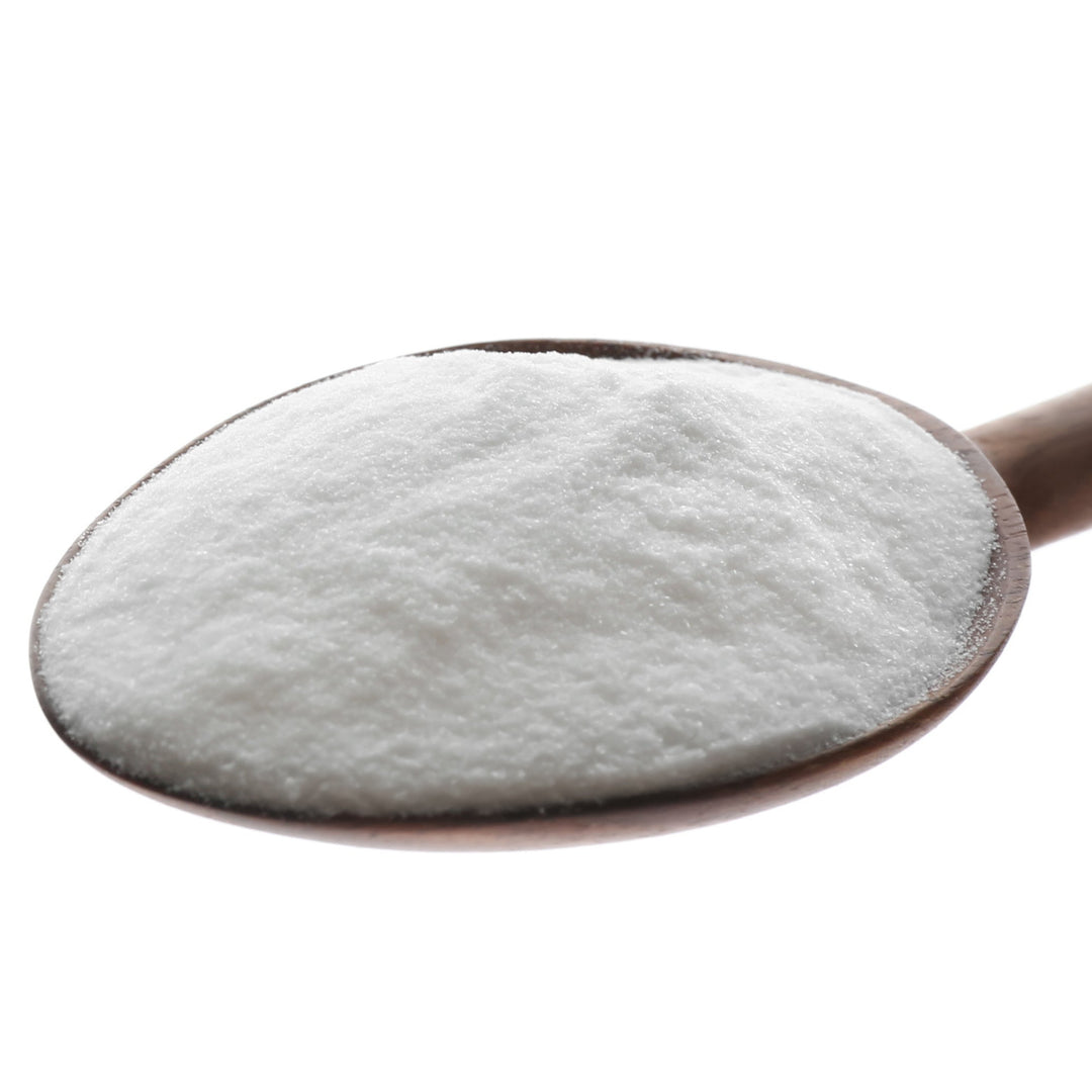 A spoonful of white powdery substance, likely Ascorbyl Palmitate powder, on a white background.