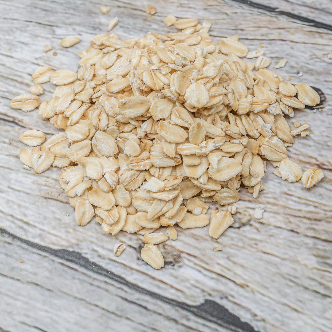 Oats on wood background