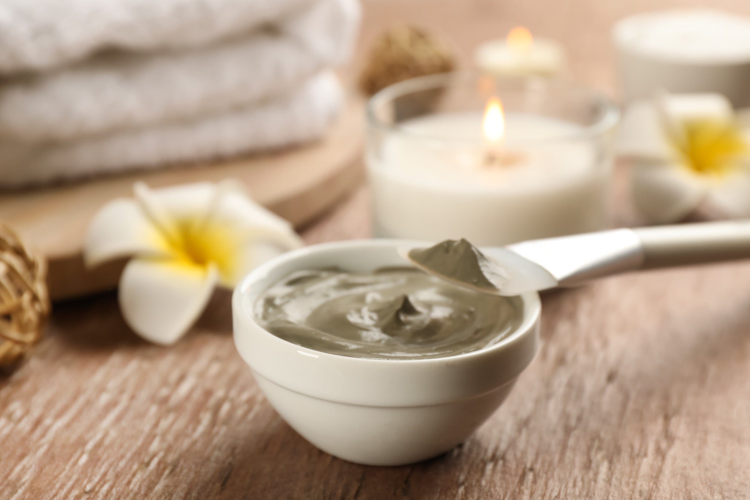 Dead Sea Mud in a ceramic bowl with minerals and natural spa elements.