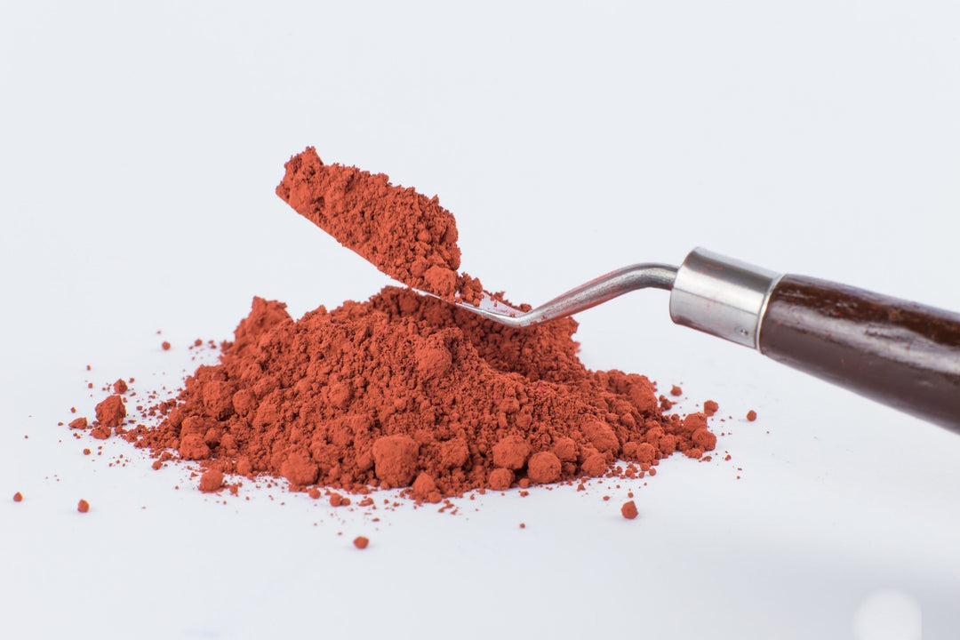 Astaxanthin powder on white background