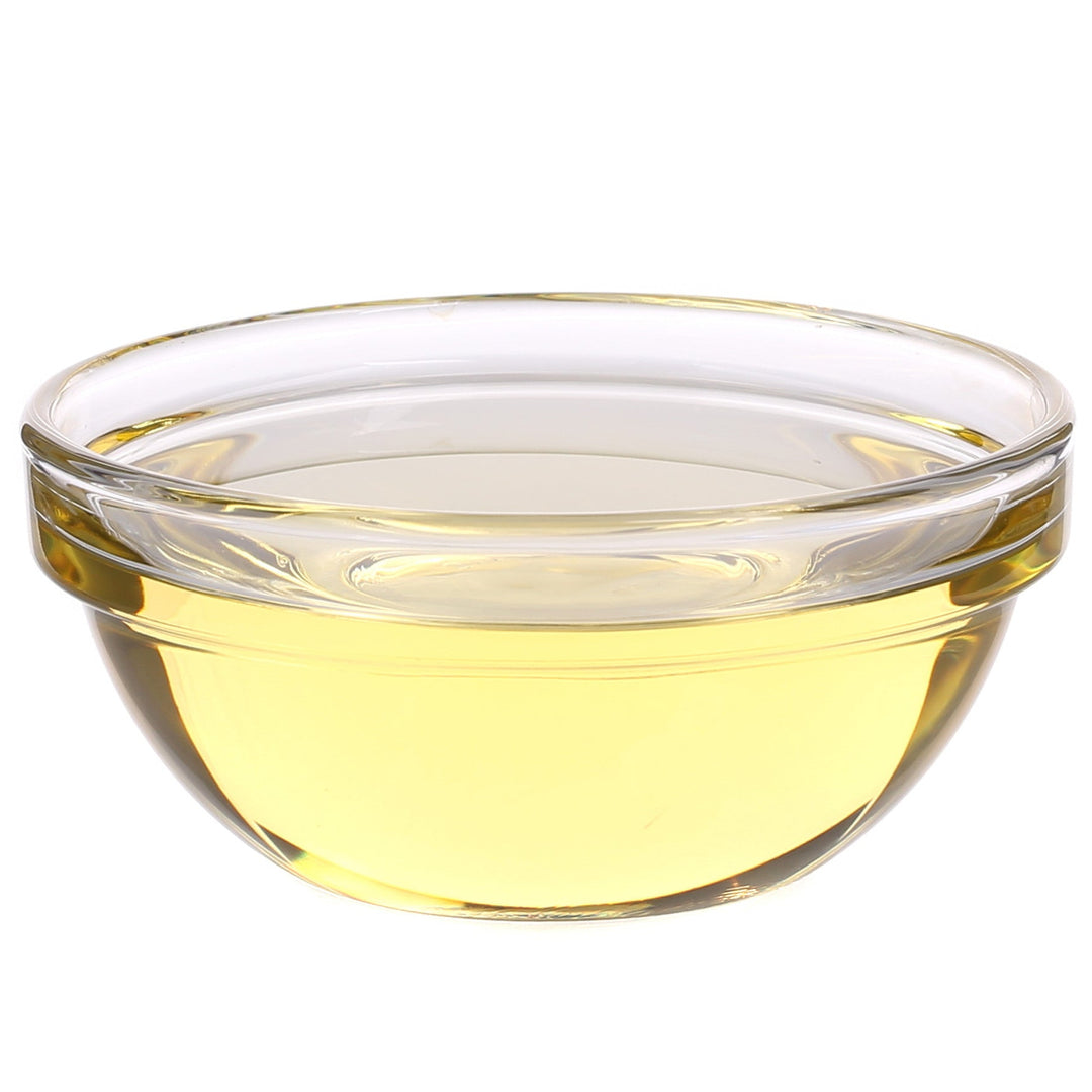 Light hazy yellow liquid in a clear glass bowl.