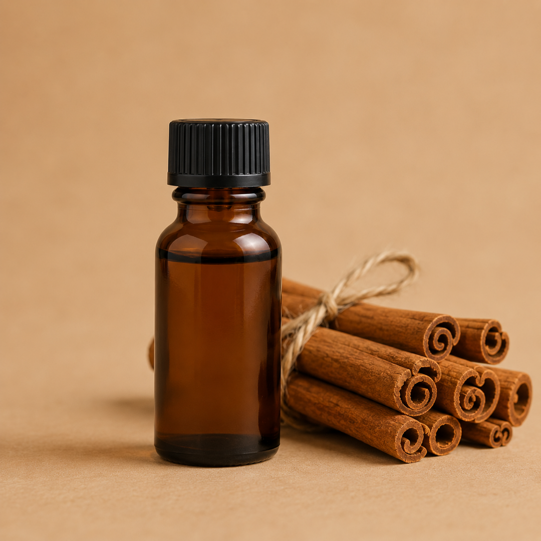Tan background, amber bottle with tied cinnamon sticks