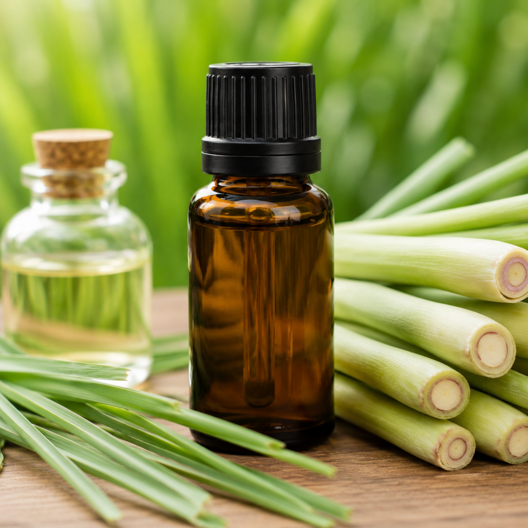 Bottle of essential oil with lemongrass on a wooden surface